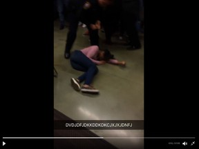 A video shows a police officer, surrounded by shouting students at a high school in Rolesville, N.C., lifting and then dropping the girl to the floor. (Twitter video screenshot)