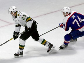 London Knights forward Cliff Pu can?t beat Spitfires goalie Michael DiPietro from in close as defenceman Sean Day follows the play during their OHL game at WFCU Centre in Windsor on Tuesday night. The Spitfires scored four times in the third period to win 5-1. (NICK BRANCACCIO/The Windsor Star)