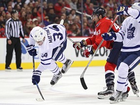 Auston Matthews of the Toronto Maple Leafs is checked by Tom Wilson of the Washington Capitals during the second period at Verizon Center on Jan. 3, 2017. (Patrick Smith/Getty Images)
