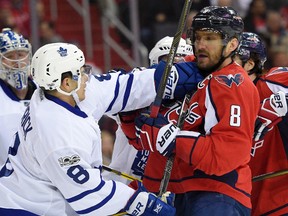 Maple Leafs defenceman Connor Carrick scuffles with Alex Ovechkin of the Capitals last night in Washington. There was no word on what Carrick’s father Jory thought of the exchange. (NICK WASS/AP)