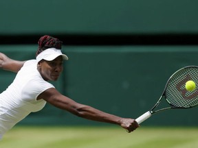 Venus Williams of the U.S returns to Angelique Kerber of Germany during their women's singles match on day eleven of the Wimbledon Tennis Championships in London, Thursday, July 7, 2016. (AP Photo/Kirsty Wigglesworth)