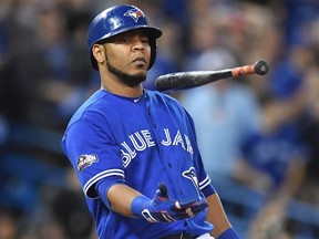 In this Oct. 19, 2016 file photo, Toronto Blue Jays' Edwin Encarnacion flips his bat after a foul ball against the Cleveland Indians during fourth inning in Game 5 of baseball's American League Championship Series in Toronto. (Frank Gunn/The Canadian Press via AP, File)