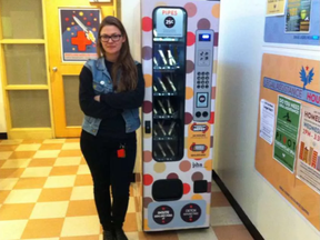 Kailin See, director of the Drug Users Resource Centre on East Cordova Street in Vancouver, stands beside a vending machine that dispenses crack pipes for 25-cents. (Postmedia)