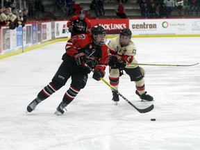 CFR Bisons forward Tyler Petrie, of Airdrie, tries to set up a scoring opportunity against the Red Deer Optimist Chiefs in the first game of the 2016 Mac’s Midget AAA Hockey Tournament. The Bisons won 5-2 on Dec. 26 at the Father David Bauer Arena. The Bisons went 4-0 in round robin but lost out in the semifinals to the Saskatoon Contacts.