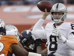 In this Sunday, Jan. 1, 2017, photo, Oakland Raiders quarterback Connor Cook passes against the Denver Broncos in the first half of an NFL football game in Denver. (AP Photo/Jack Dempsey)