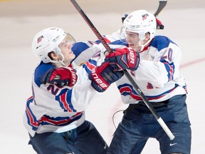 Team USA's Troy Terry (right) celebrates with Team USA's Jack Roslovic (28) after scoring the winning goal during the shootout in the World Junior Hockey Championship semifinal action in Montreal on Wednesday, Jan. 4, 2017. (Ryan Remiorz/The Canadian Press)