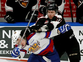 Edmonton Oil Kings' Branden Klatt is checked by Vancouver Giants' Dmitry Osipov at Rogers Place on Jan. 4, 2017. (Larry Wong)