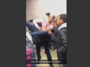 In this Tuesday, Jan. 3, 2017, image made from video and released by Pam C. Akpuda, officer Ruben De Los Santos of the Rolesville Police Department slams a teenage girl to the floor in Rolesville, N.C. The student who was slammed to the ground by a police officer was trying to break up a fight involving her sister, said the 15-year-old who posted video of the incident. (Pam C. Akpuda via AP)
