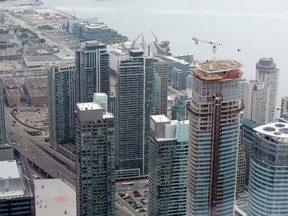 Condominiums rise up over the Gardiner Expressway in downtown Toronto on September 10, 2014. (Peter J. Thompson/Postmedia Network)