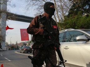 Turkish special security force members patrol near the scene of the Reina night club following the New Year's day attack, in Istanbul, Wednesday, Jan. 4, 2017. Turkey has identified the gunman in the Istanbul nightclub massacre, the foreign minister said Wednesday as the president vowed that the country won't surrender to terrorists or become divided. (AP Photo/Emrah Gurel)