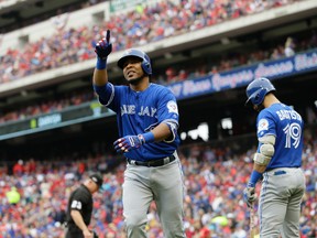 In this Oct. 7, 2016, file photo, Toronto Blue Jays' Edwin Encarnacion celebrates his solo home run off a pitch from Texas Rangers' Yu Darvish in the fifth inning of Game 2 of baseball's American League Division Series in Arlington, Texas. (AP Photo/LM Otero, File)