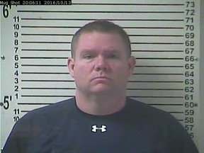 This Oct. 13, 2016 booking image released by the Hardin County Detention Center, shows Stephen Kyle Goodlett, the former principal of LaRue County High School. Goodlett, of Elizabethtown, Ky., was indicted Wednesday, Jan. 5, 2017, in Louisville on federal charges of possessing and transporting child pornography, news outlets reported. He admitted to seizing students’ phones so that he could steal pornographic images from them and trade them online, investigators said. (Hardin County Detention Center via AP)