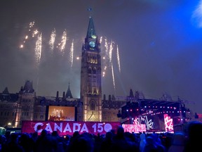 Fireworks explode behind the Peace Tower during a celebration on Parliament Hill in Ottawa on New Year's Eve. The new year is only a week old but columnist Nadene Grieve-Deslippe is already thinking about Good Friday. (Justin Tang/The Canadian Press)