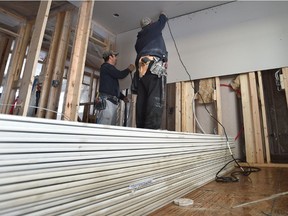 DCL Drywall Inc. contractors installing drywall in a new duplex for story on wrap up of hearing into drywall tariff for Western Canada, in north Edmonton, Wednesday, December 7, 2016.