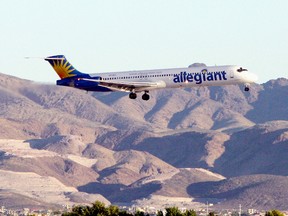 An Allegiant Air jet carrying members of the New Orleans Fire Department comes in for a landing at McCarran International Airport on September 6, 2005 in Las Vegas, Nevada. (Ethan Miller/Getty Images)