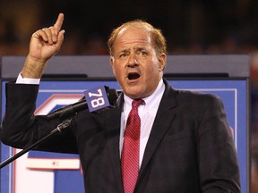 In this Sept. 15, 2016, file photo, Chris Berman introduces former Buffalo Bills Hall of Fame defensive end Bruce Smith during his jersey retirement ceremony at halftime of an NFL football game, in Orchard Park, N.Y. (AP Photo/Bill Wippert, File)