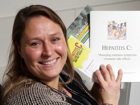 Luke Hendry/The Intelligencer
Program manager Stephanie McFaul holds information about hepatitis C, Wednesday, at Hastings Prince Edward Public Health in Belleville. She said treatment can cure more than 90 per cent of cases — but 70 per cent of people carrying the virus don't know they're infected.