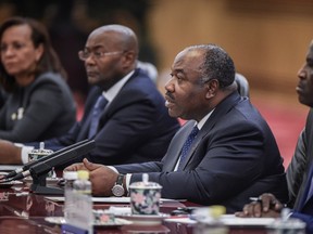 Gabon's President Ali Bongo Ondimba, second from right, speaks to his Chinese counterpart Xi Jinping during a meeting in the Great Hall of the People in Beijing on December 7, 2016. (FRED DUFOUR/AFP/Getty Images)
