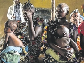 EDUARDO SOTERAS/AFP/Getty Images
Women and children attend a program for malnourished children sponsored by the World Food Program at a Health Center in Mavivi, Congo, in November. Malnutrition is very common in the country and the problem has been amplified lately in the area by the influx of displaced people fleeing a surge in violence.