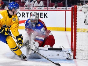 Fredrik Karlstrom of Team Sweden is stopped by goaltender Ilya Samsonov of Team Russia during the 2017 IIHF World Junior Championship bronze medal game at the Bell Centre on January 5, 2017 in Montreal, Quebec, Canada. (Minas Panagiotakis/Getty Images)