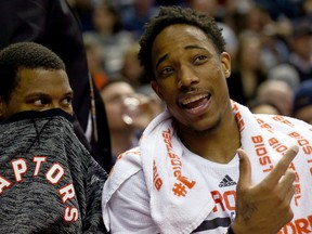 Kyle Lowry and DeMar DeRozan of the Raptors joke around on the bench during a game against the 76ers in Toronto on Nov. 28, 2016. (Dave Abel/Toronto Sun)
