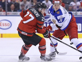 Mikhail Sergachyov of Team Russia skates against Mitchell Stephens of Team Canada during a game at the the 2017 IIHF World Junior Hockey Championships at the Air Canada Centre. (Claus Andersen/Getty Images)