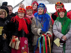 File - People dressed in traditional Ukrainian clothing attend the water blessing service at the Ukrainian Cultural Heritage Village, where the annual Feast of Jordan was held on Sunday January 19, 2014 to celebrate the Ukrainian Christmas season. Larry Wong / Postmedia