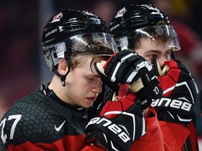 Peterborough's Mitchell Stephens (27), a forward with Team Canada, reacts after losing to the United States in gold medal game hockey action at the IIHF World Junior Championship, Thursday, January 5, 2017 in Montreal. THE CANADIAN PRESS/Paul Chiasson