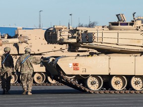 U.S. Tanks were unloaded in Bremerhaven, northern Germany, Friday Jan. 6, 2017. Ships loaded with U.S. tanks, self-propelled howitzers and hundreds of other fighting vehicles have arrived in the northern German port en route to Eastern Europe to bolster NATO’s deterrence to possible Russian aggression. (Ingo Wagner/dpa via AP)