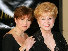 Actress Carrie Fisher (L) and her mother, actress Debbie Reynolds, arrive for Dame Elizabeth Taylor's 75th birthday party at the Ritz-Carlton, Lake Las Vegas on February 27, 2007 in Henderson, Nevada. (Photo by Ethan Miller/Getty Images)