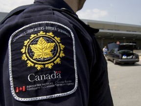 A border agent stands at the St-Bernard-de-Lacolle crossing.