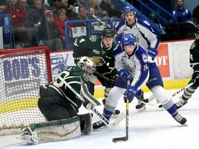 Shane Bulitka, right, of the Sudbury Wolves, puts the puck past goalie Emanuel Vella, of the London Knights, during OHL action at the Sudbury Community Arena in Sudbury, Ont. on Friday November 4, 2016. (John Lappa, Postmedia Network)