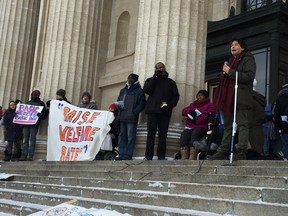 Make Poverty History's Josh Brandon addresses a rally at the Manitoba Legislature on Friday. (DAVID LARKINS/WINNIPEG SUN)