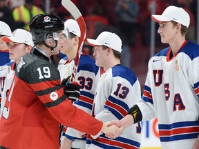 Canada forward Dylan Strome (19) congratulates U.S. forward Tage Thompson (29) on his team's victory in the gold medal game during the World Junior Hockey Championship in Montreal on Thursday, Jan. 5, 2017. (Paul Chiasson/The Canadian Press)