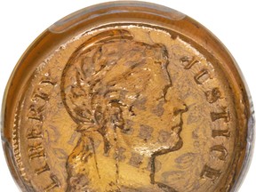 This undated photo provided by Heritage Auctions shows a glass U.S. penny. The rare coin was manufactured as a possible alternative to copper during WWII. Heritage Auctions announced Friday, Jan. 6, 2017, that the penny was sold during Thursday's auction based in Fort Lauderdale to an American buyer who wishes to remain anonymous.(Matt Poppolo/ Heritage Auctions via AP)