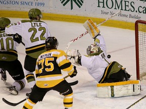 Kingston Frontenacs Linus Nyman watches the puck roll past North Bay Battalion goalie Juliam Sime during  Ontario Hockey League action at the Rogers K-Rock Centre on Friday. (Ian MacAlpine /The Whig-Standard)