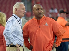 Browns owner Jimmy Haslam (left) and head coach Hue Jackson watch warm-ups before an NFL preseason game against the Buccaneers in Tampa, Fla., on Aug. 26, 2016. The Browns finished the season 1-15. (Phelan M. Ebenhack/AP Photo/Files)