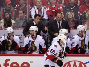 Senators head coach Guy Boucher speaks to his players from the bench during the third period of an NHL game against the Capitals in Washington on Jan. 1, 2017. (Molly Riley/AP Photo)