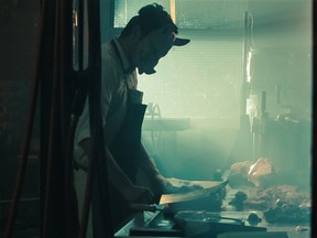 On one of the sets where the butcher, a character in the movie, "The Savage Tales of Frank MacGuffin," is cutting meat.