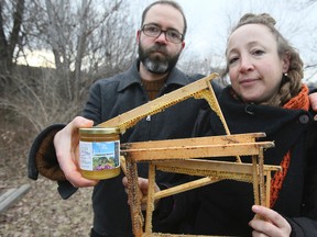 Beekeeper Shawn Caza (L) and Melissa Berney lament the vandalization of bee hives at Fort York on Saturday, January 7, 2017, in Toronto. (Veronica Henri/Toronto Sun)