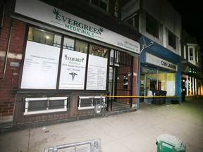 Police tape outside Evergreen Medicinals on Dundas St. W. in Toronto on Friday, January 6, 2017 after a stabbing. (Veronica Henri/Toronto Sun)