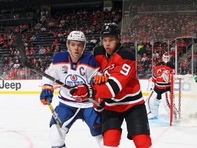 Connor McDavid #97 of the Edmonton Oilers goes head-to-head with Taylor Hall #9 of the New Jersey Devils during the first period at the Prudential Center on January 7, 2017 in Newark, New Jersey. (Photo by Bruce Bennett/Getty Images