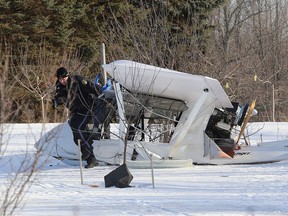 Ontario Provincial Police investigate an ultralight plane crash that occurred on Saturday afternoon south of Camden East. Two occupants of the ultralight were taken to hospital with non-life threatening injuries. (Ian MacAlpine /The Whig-Standard)