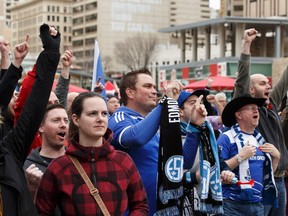 Fans cheer while watching FC Edmonton play on the road at Winter City Footie Fest at Churchill Square in Edmonton, Alberta on Saturday, November 5, 2016
