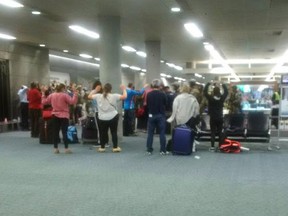 Passengers at Terminal 1 of Fort Lauderdale-Hollywood Intenational Airport were told to raise their arms before evacuating Friday.
