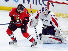 Senators forward Jean-Gabriel Pageau (44) looks on as the puck is deflected off of Capitals goalie Braden Holtby (70) during second period NHL action in Ottawa on Saturday, Jan. 7, 2017. (Fred Chartrand/The Canadian Press)