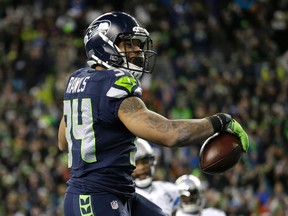 Seahawks running back Thomas Rawls celebrates after he rushed for a touchdown against the Lions during second half NFC wild card action in Seattle on Saturday, Jan. 7, 2017. (Elaine Thompson/AP Photo)