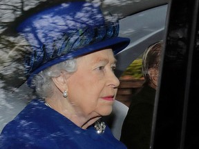 Queen Elizabeth II in a car with Prince Philip, arrives to attend the morning church service at St Mary Magdalene Church in Sandringham, England, Sunday Jan. 8, 2017.  (Chris Radburn/PA via AP)