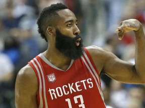 Houston Rockets guard James Harden reacts to hitting a three pointer during the second half of an NBA basketball game against the Dallas Mavericks in Dallas, Tuesday, Dec. 27, 2016. (AP Photo/LM Otero)