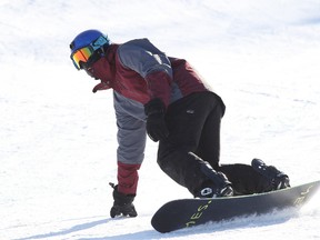 A snow boarder makes their way down Lively Ski Hill  in Sudbury, Ont. on Sunday January 8, 2017. Gino Donato/Sudbury Star/Postmedia Network